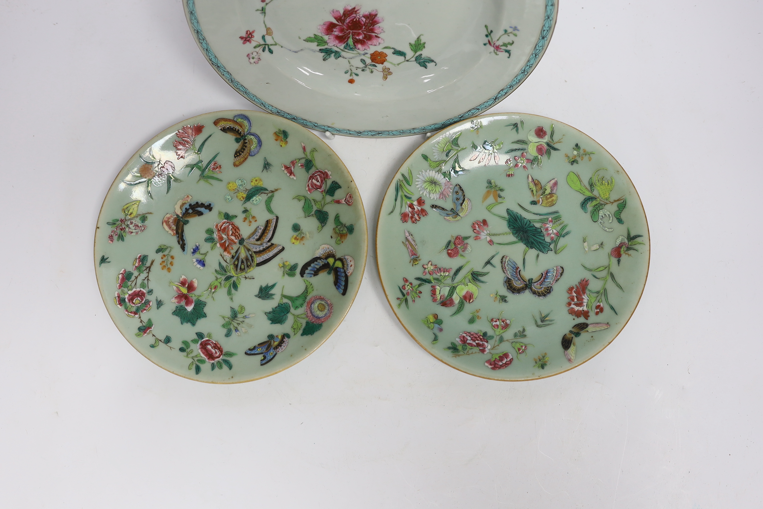 An 18th century Chinese export famille rose plate, 23cm diameter, and two 19th century celadon famille rose plates
